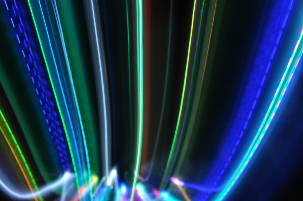 Abstract streaks of coloured light on a dark background