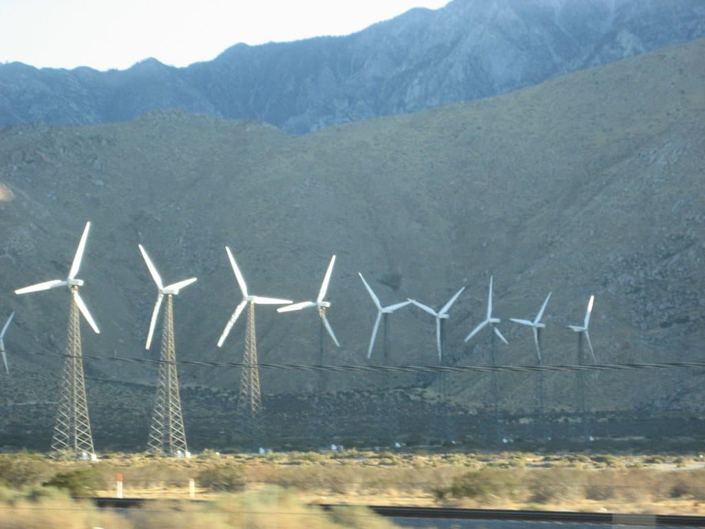 Wind turbines in front of a mountain range