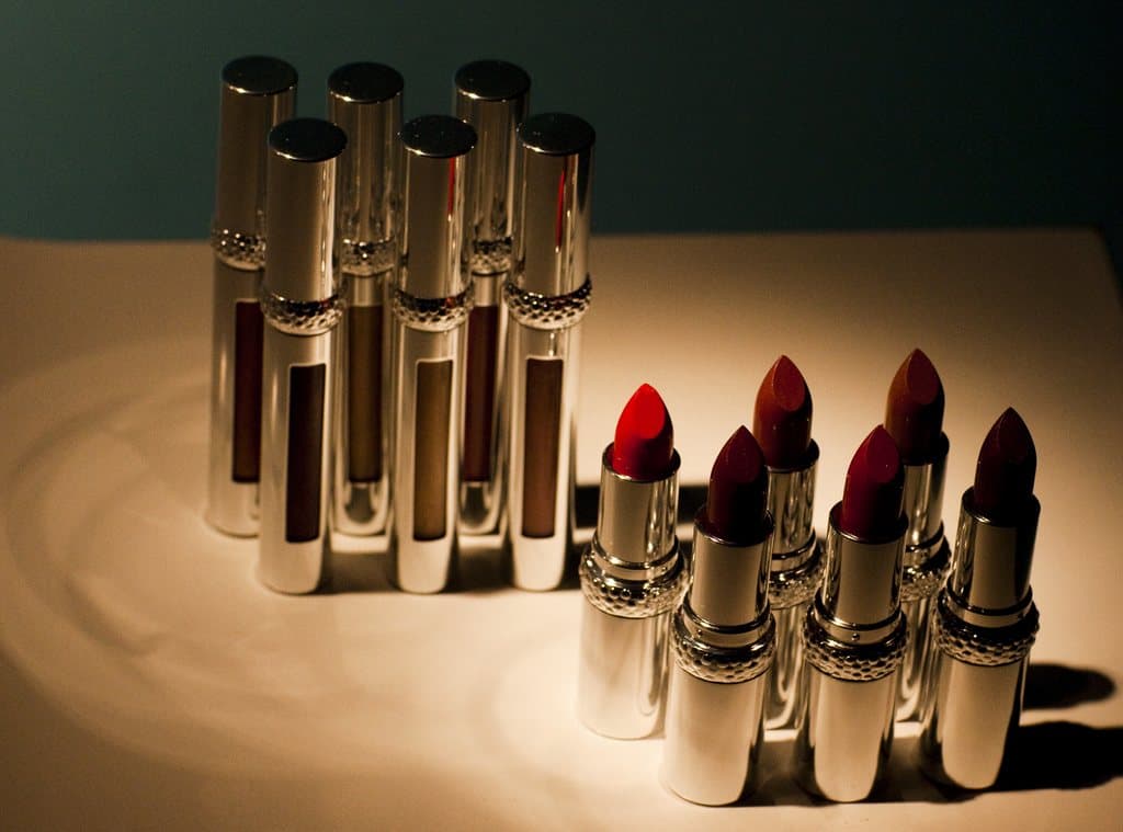 Cosmetics arranged on a lit display surface