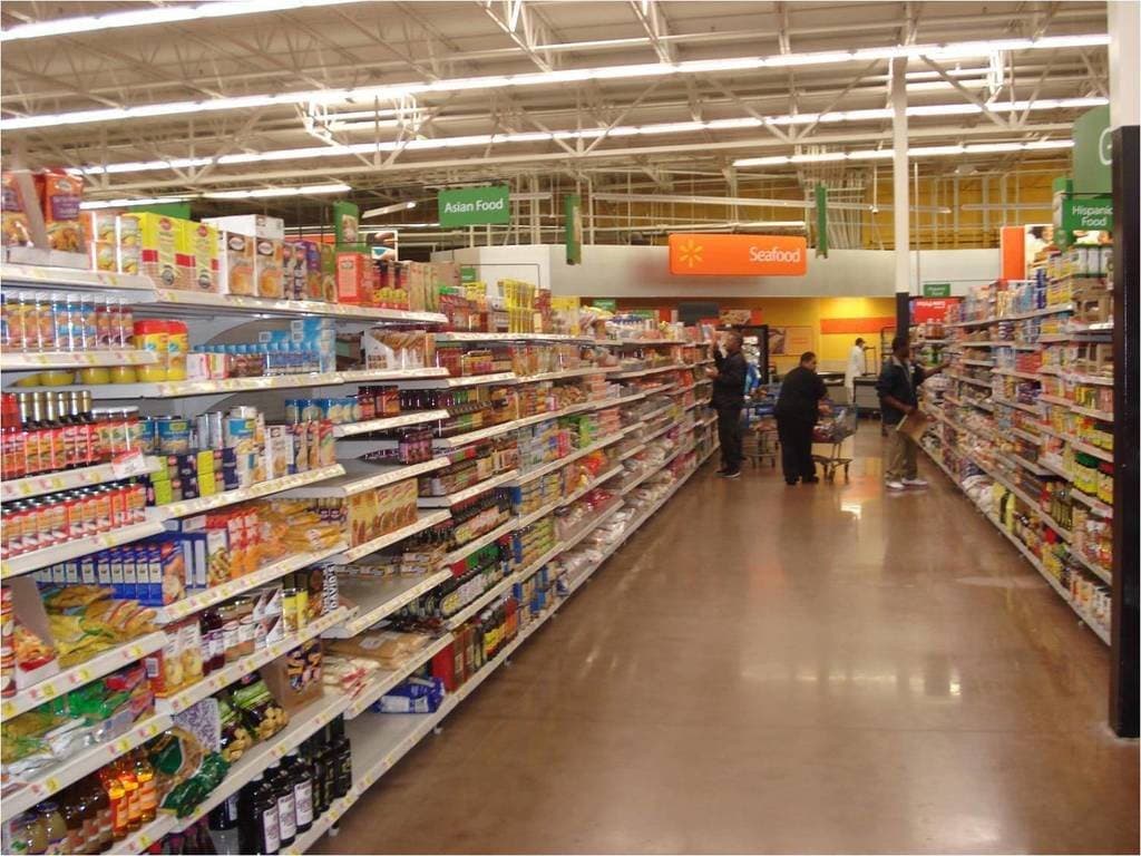 Supermarket aisle with stocked shelves